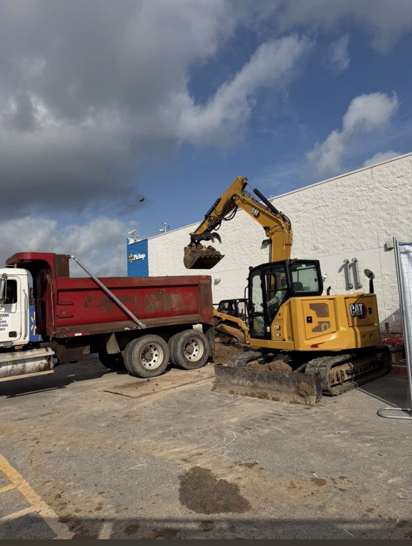 Excavator loading dump truck
